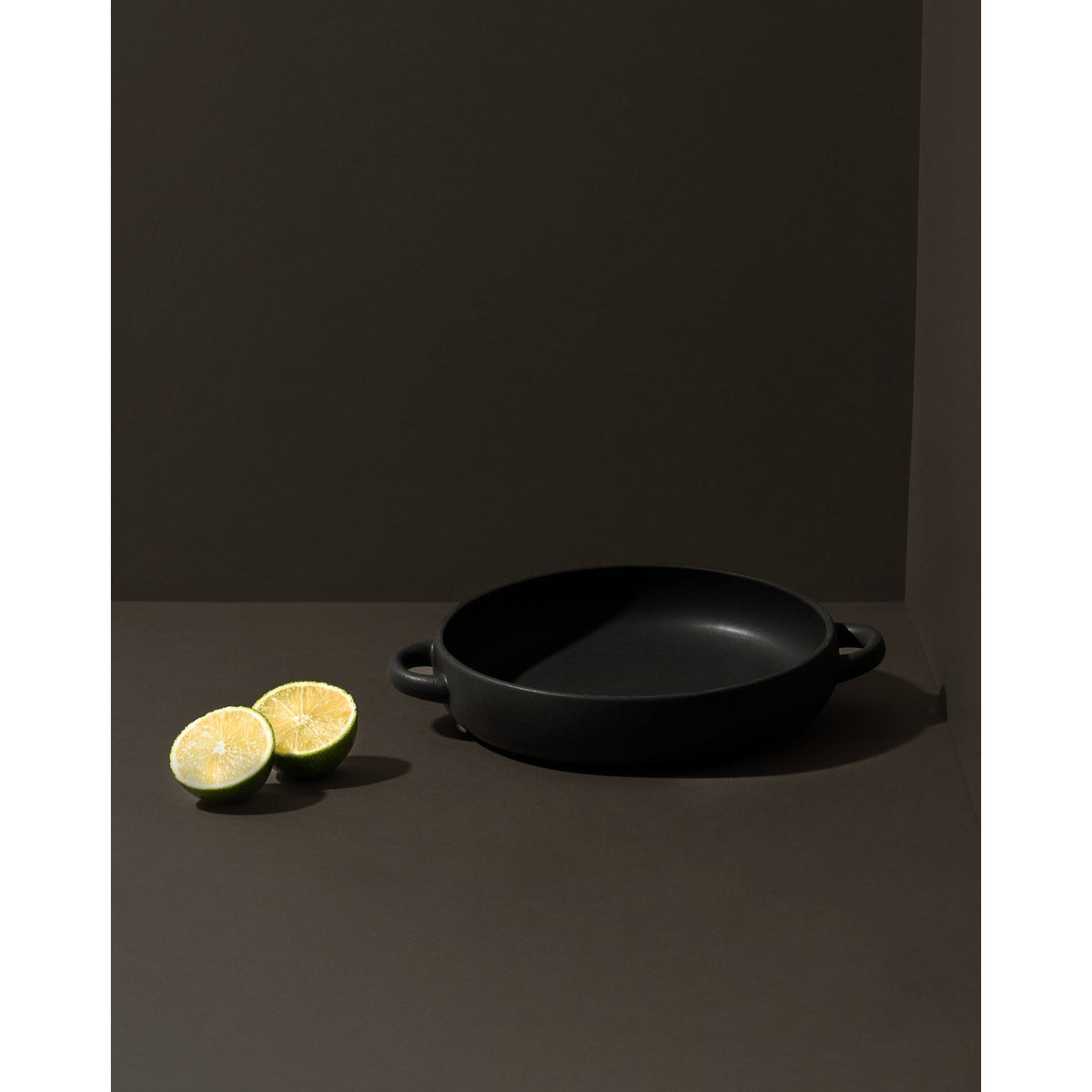 Gharyan stoneware plate with handles in matte black, Patina Vancouver