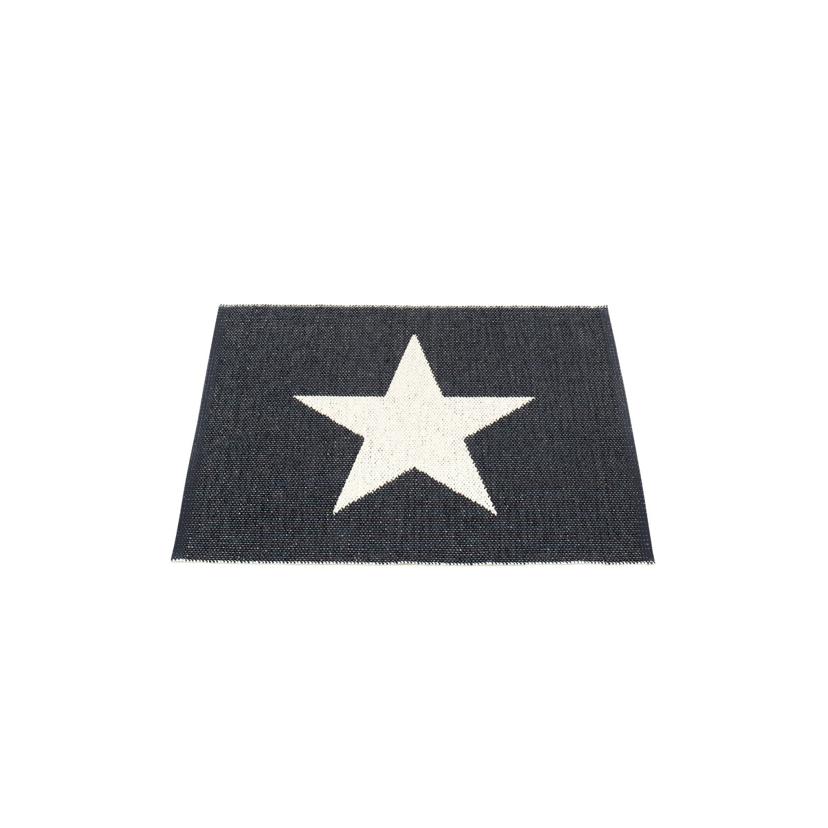 Pappelina Viggo woven PVC rug with a graphic black star on white, 70 x 90 cm, Patina Vancouver