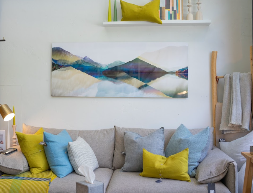 Framed prints and mirrors on the wall at Patina Home Interiors, Whistler